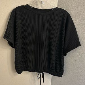 Black top with tie at the bottom